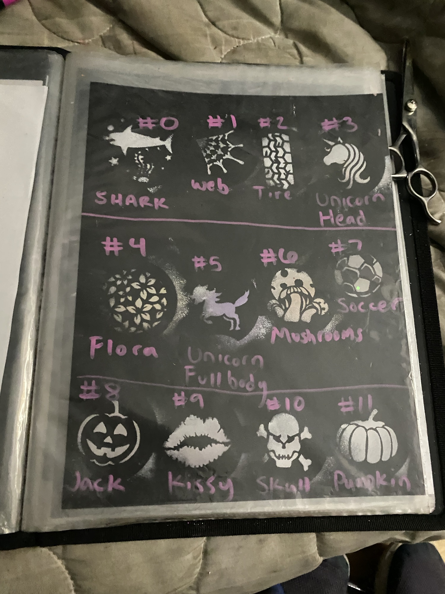 White stencils on black card stock paper.